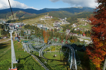 People on ski lift in Bukovel village, largest ski resort in Carpathians