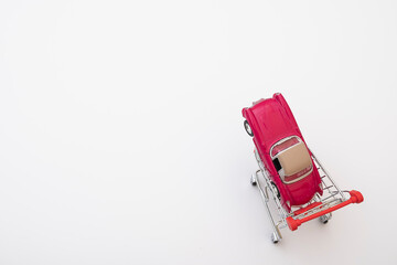 grocery cart and small car