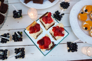 Plate of cakes with strawberries at a wedding reception