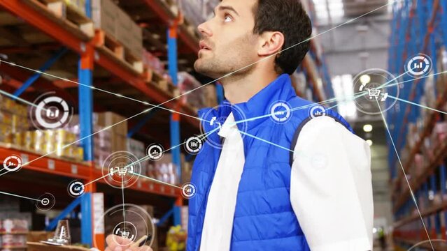 Animation of network of digital icons on caucasian male supervisor checking stock at warehouse