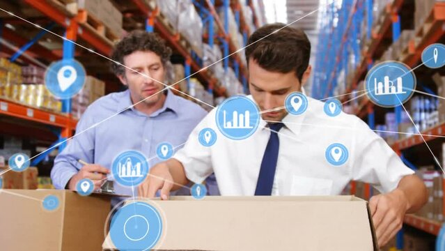 Animation of network of digital icons on two caucasian male supervisors checking boxes at warehouse