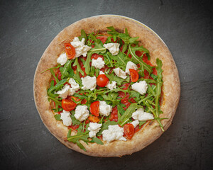 Fresh mozzarella tomato pizza, close-up, vibrant colors, basil garnish, homemade Italian cuisine, tasty meal