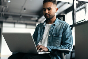 Modern Office: Portrait of Stylish Businessman Works on Laptop, Does Data Analysis and Creative Designer