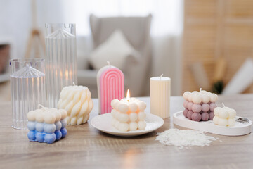 Fototapeta na wymiar set of colorful handmade candles on the table
