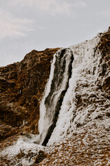 Winter raw landscapes in Iceland. The waterfall in a background
