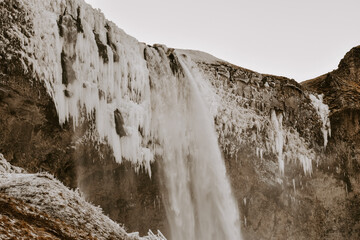 Winter raw landscapes in Iceland. The waterfall in a background