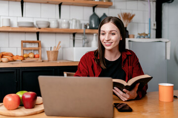 Young businesswoman reading a book to thinking about strategy of