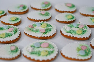 A table with decorated Easter cookies on it