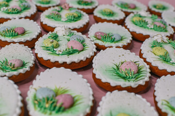 A table with decorated Easter cookies on it
