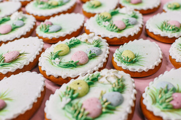 A table with decorated Easter cookies on it