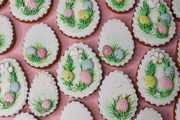 A table with decorated Easter cookies on it