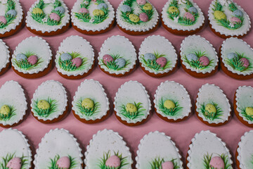 A table with decorated Easter cookies on it
