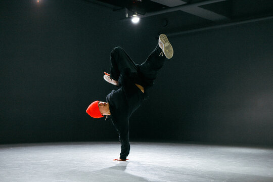 bboy freezes in one pose in stylish studio a man Hiphop dancer 
