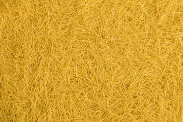 Italian raw pasta filini vermicelli from durum wheat. Food and ingredientes background.