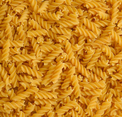 Fusilli background.Pile of raw italian fusilli pasta.