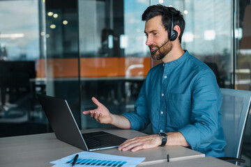 Male manager in headphones having a video call