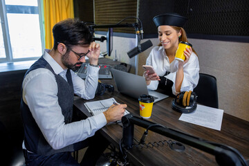 Radio dj talking to a guest in a radio studio