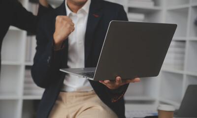 Business professionals. Group of young confident business people analyzing data using computer while spending time in the office