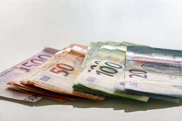 Closeup shot of different Euro banknotes with white background