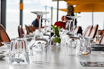 Fototapeta na wymiar Selective focus of wineglasses turned upside down on the restaurant table