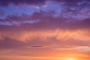 Amazing purple, orange sunset in the clouds.
