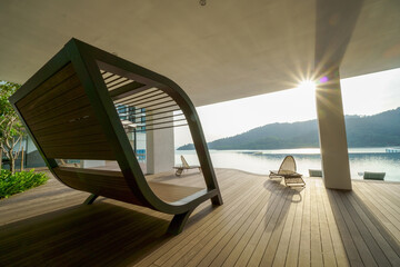Shot of a modern condominium rest area of a building near the swimming pool with the sun shining