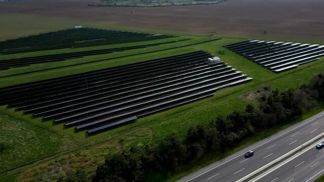 High angle view of the fields with solar panels near the highway, Trnava, 4k