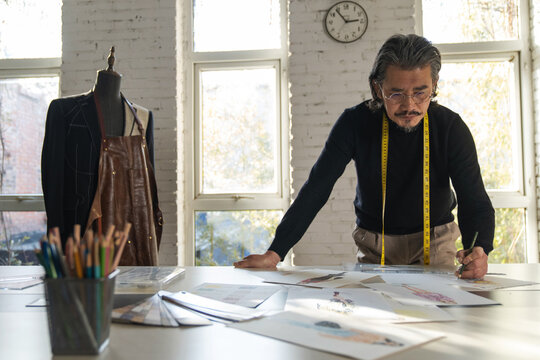 Authoritative fashion designers draw design drafts