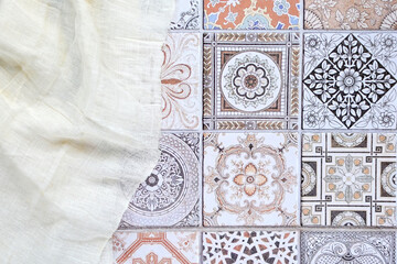 Kitchen cloth and vintage tiles background 
