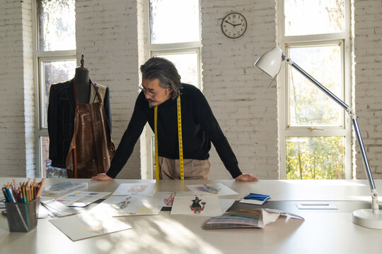 Authoritative fashion designers draw design drafts