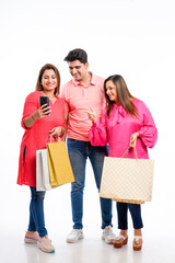 Obraz premium Indian people group holding shopping bags on white background.