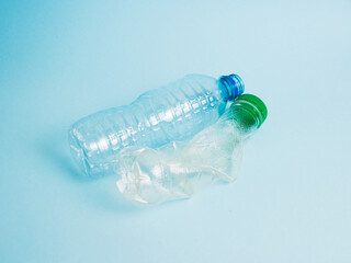 Plastic bottles on a blue background. Concept for earth and zero waste