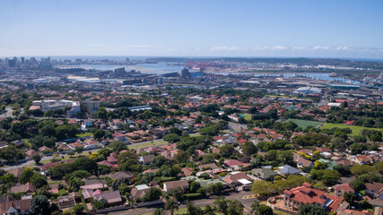 An wide view over the residential area of Durban to the harbor and city skyline in the distance.