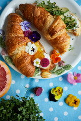 Croisant With pansies and Jam. Breakfast. Top view.