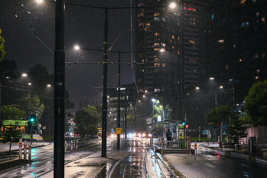 Empty tram tracks on a wet rainy night in Melbourne, Australia