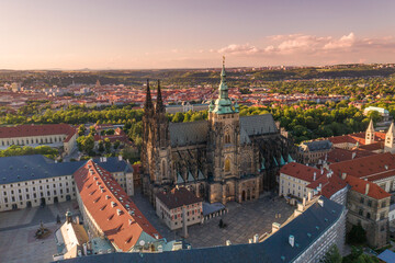 Sunset in Prague Old Town with St. Vitus Cathedral and Prague castle complex with buildings...