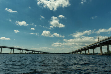 Fort Myers Landscape and Cityscape with Water and Cloudy Blue Sky. Caloosahatchee river and Bridges. Florida, USA