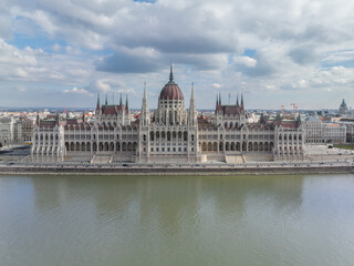 Fototapeta na wymiar Awe Inspiring Drone Shot of Hungarian Parliament Building and Danube River in Budapest Cityscape from a Bird's Eye View