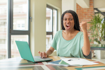 black afro woman looking angry, annoyed and frustrated. studying concept