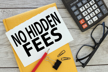 No Hidden Fees yellow notepad with notepad page with text