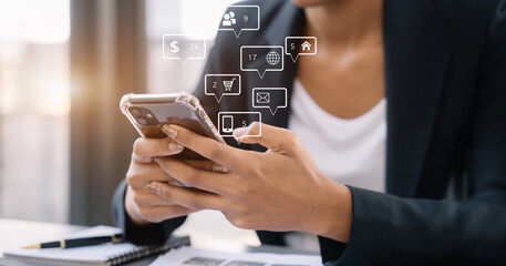 woman using mobile phone to chat with friends during free time.