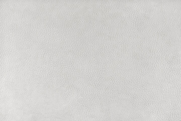 Fototapeta na wymiar Texture background of white velours fabric textured like leather surface. Fabric texture close up of upholstery furniture textile material, design interior, wall decor, backdrop, wallpaper.