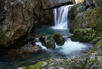Waterfall with mossy rocks in forest, Svrakava waterfall near Banja Luka