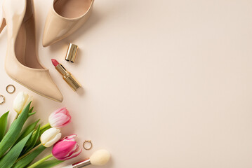 Modern Mother's Day idea. Flat lay top view of high-heels, tulip flowers, lipstick on a pastel...