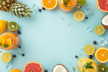 Get ready for a summer blast with this top view flat lay of citrus juices and cocktails made with...