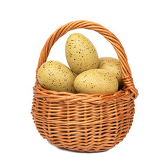 Easter eggs in the woven basket isolated on white background with clipping path.