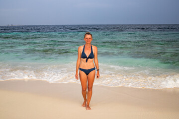 woman relaxing on beautiful tropical beach
