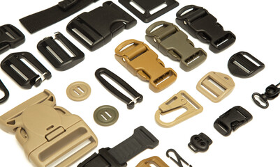 Collage of different accessories for clothes (fastex, rubber bands, buttons, locks for clothes)