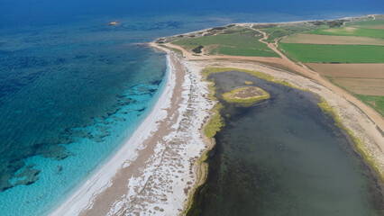 Fototapeta na wymiar aerial view of the crystalline waters of the sea of ​​is arutas and mari ermi beach in sardinia 