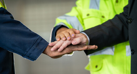 Group of young Engineer United stack hands or join hand teamwork together with Spirit diversity...